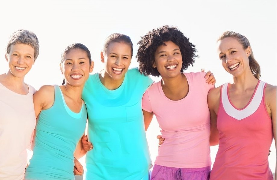 5 women holding their hands together