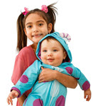 A litte girl with pig tails holding an infant in a pink and teal onsie. 